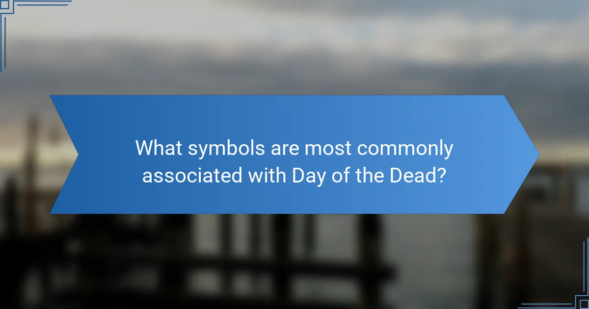 What symbols are most commonly associated with Day of the Dead?